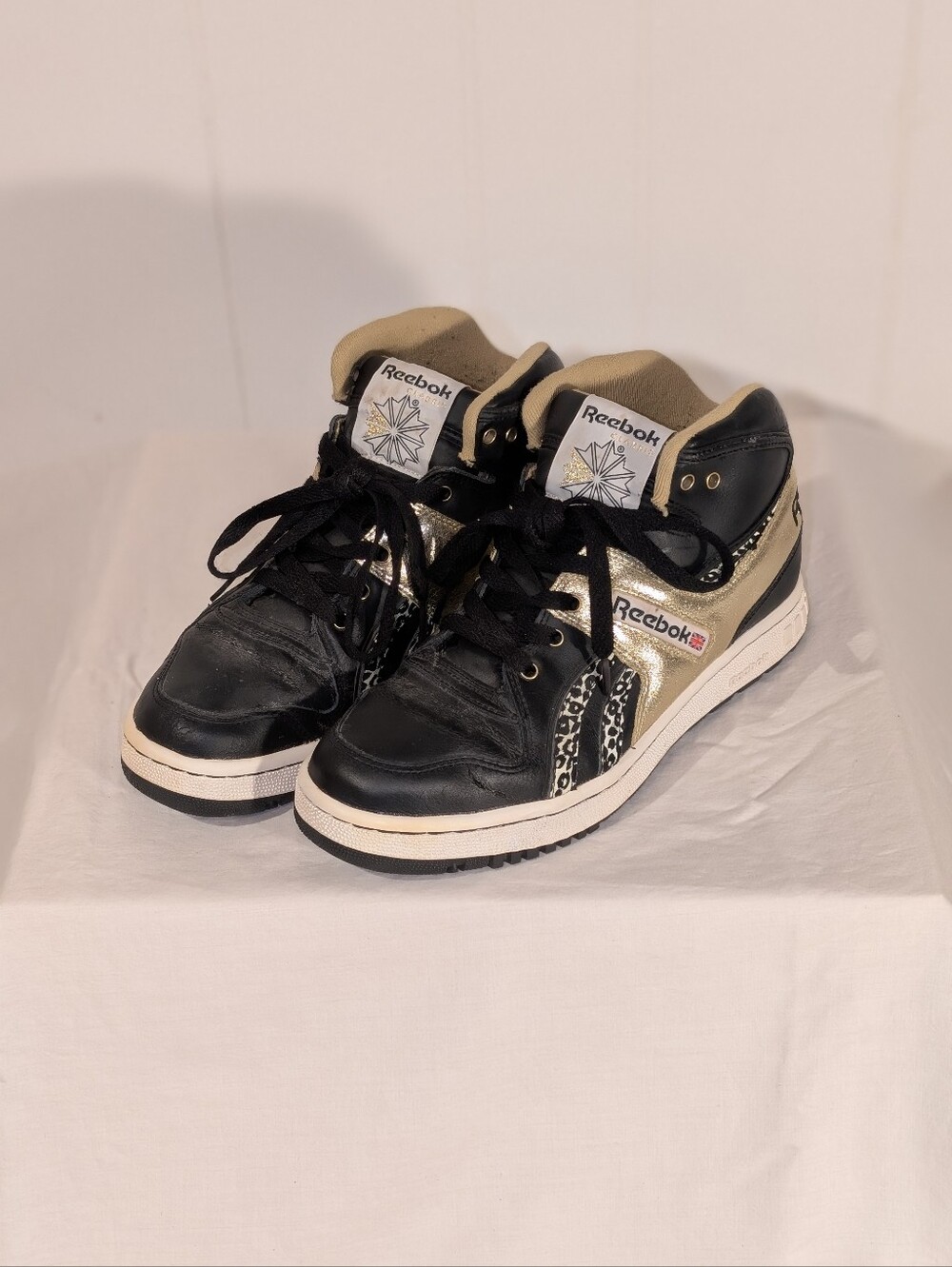 Reebok Black and Gold High-Top Sneakers with Leopard Accent